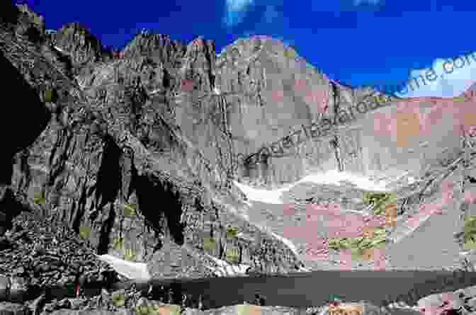 A Hiker On The Chasm Lake Trail, With Chasm Lake In The Background Day Overnight Hikes: Rocky Mountain National Park