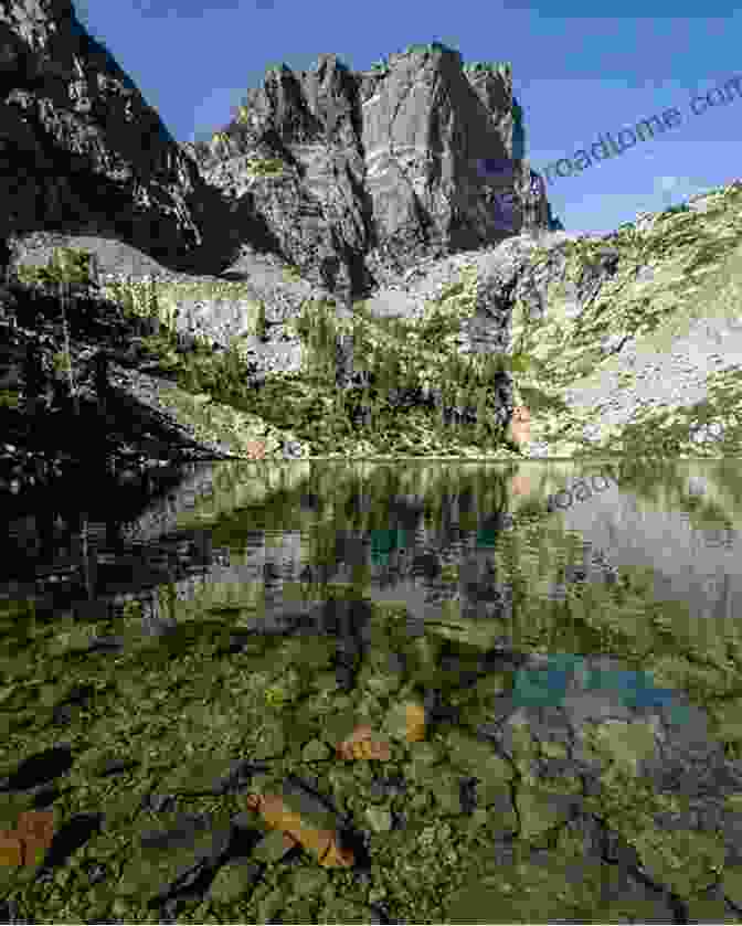 A Hiker On The Emerald Lake Trail, With Emerald Lake In The Background Day Overnight Hikes: Rocky Mountain National Park