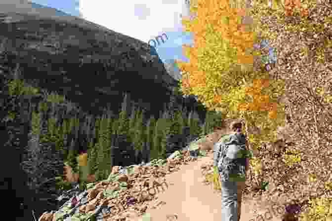 A Hiker On The Loch Vale Trail, With Loch Vale In The Background Day Overnight Hikes: Rocky Mountain National Park