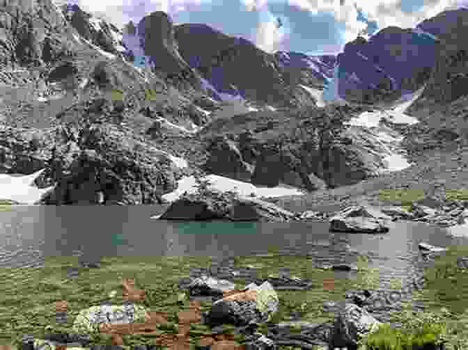 A Hiker On The Sky Pond Trail, With Sky Pond In The Background Day Overnight Hikes: Rocky Mountain National Park