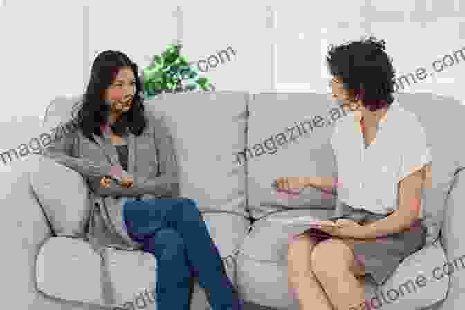 A Woman Sitting On A Couch Talking To A Therapist. Tending Inner Gardens: The Healing Art Of Feminist Psychotherapy