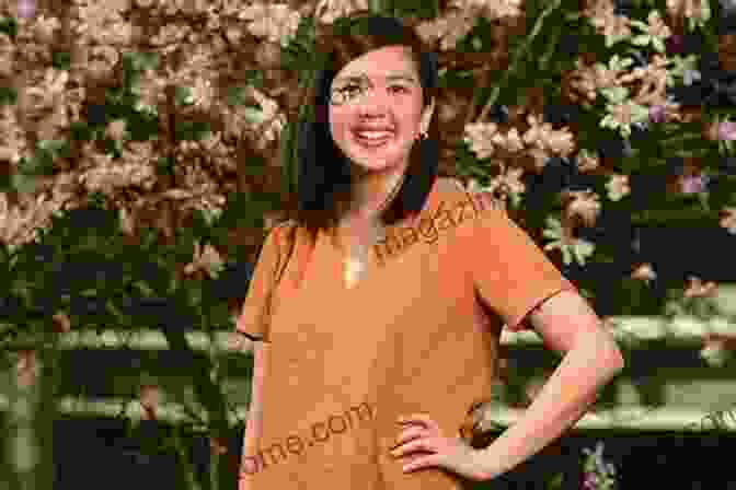 Author Emily Chan Poses For A Portrait With A Backdrop Of A Chinese Restaurant. Teethmarks On My Chopsticks: A Knucklehead Goes To Wall Street